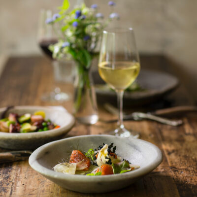 plated food with white wine at the rebello hotel