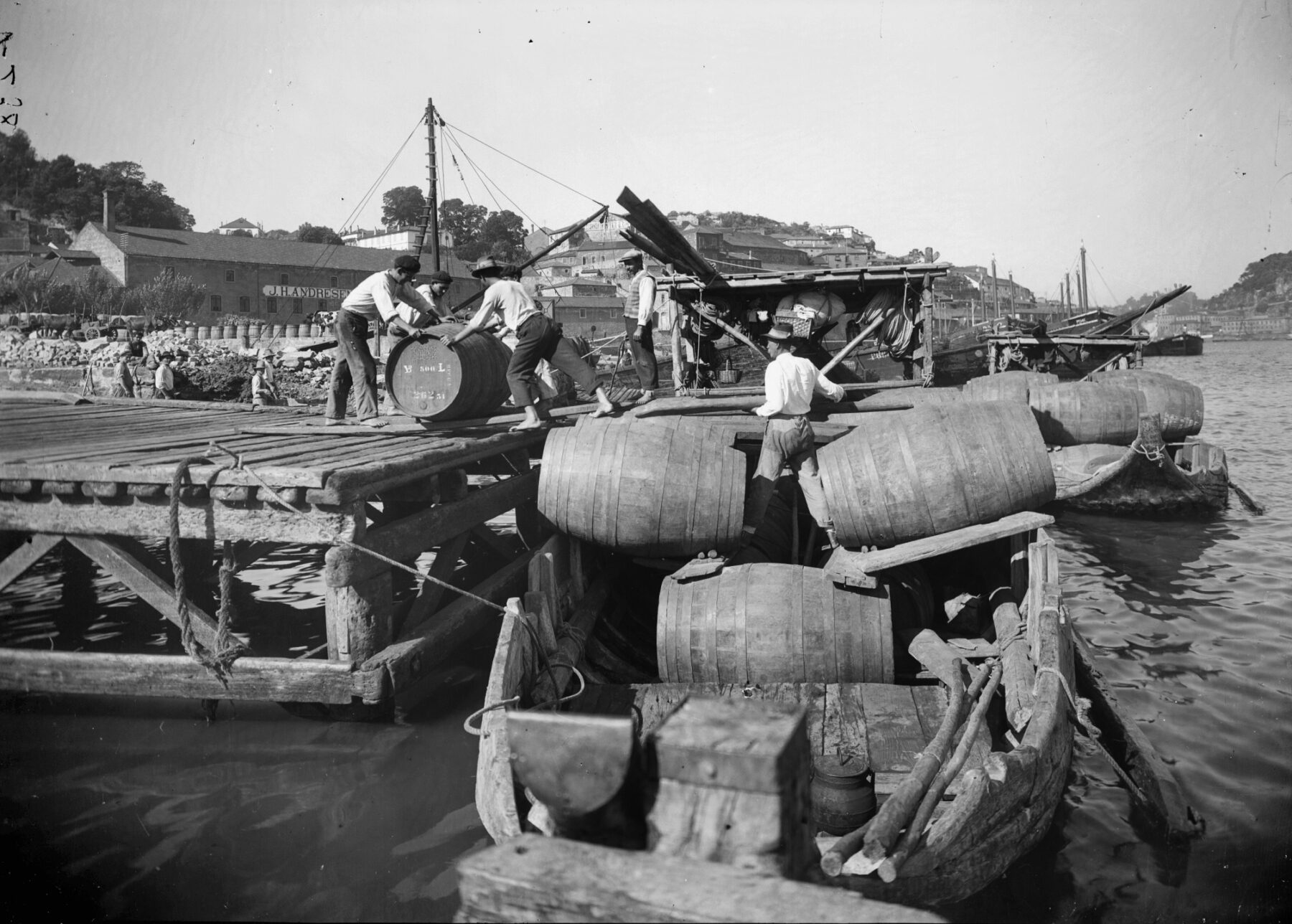 men unloading barrels in porto