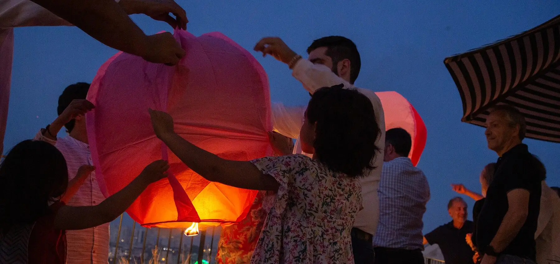 São João balloon launching in a Porto rooftop