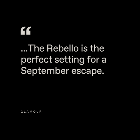 Black background with white text that reads, "...The Rebello is the perfect setting for a September escape." The word "Glamour" appears in smaller letters below.