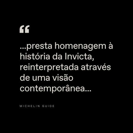 White Portuguese text on a black background: "...presta homenagem à história da Invicta, reinterpretada através de uma visão contemporânea..." with "Michelin Guide" in small letters below.