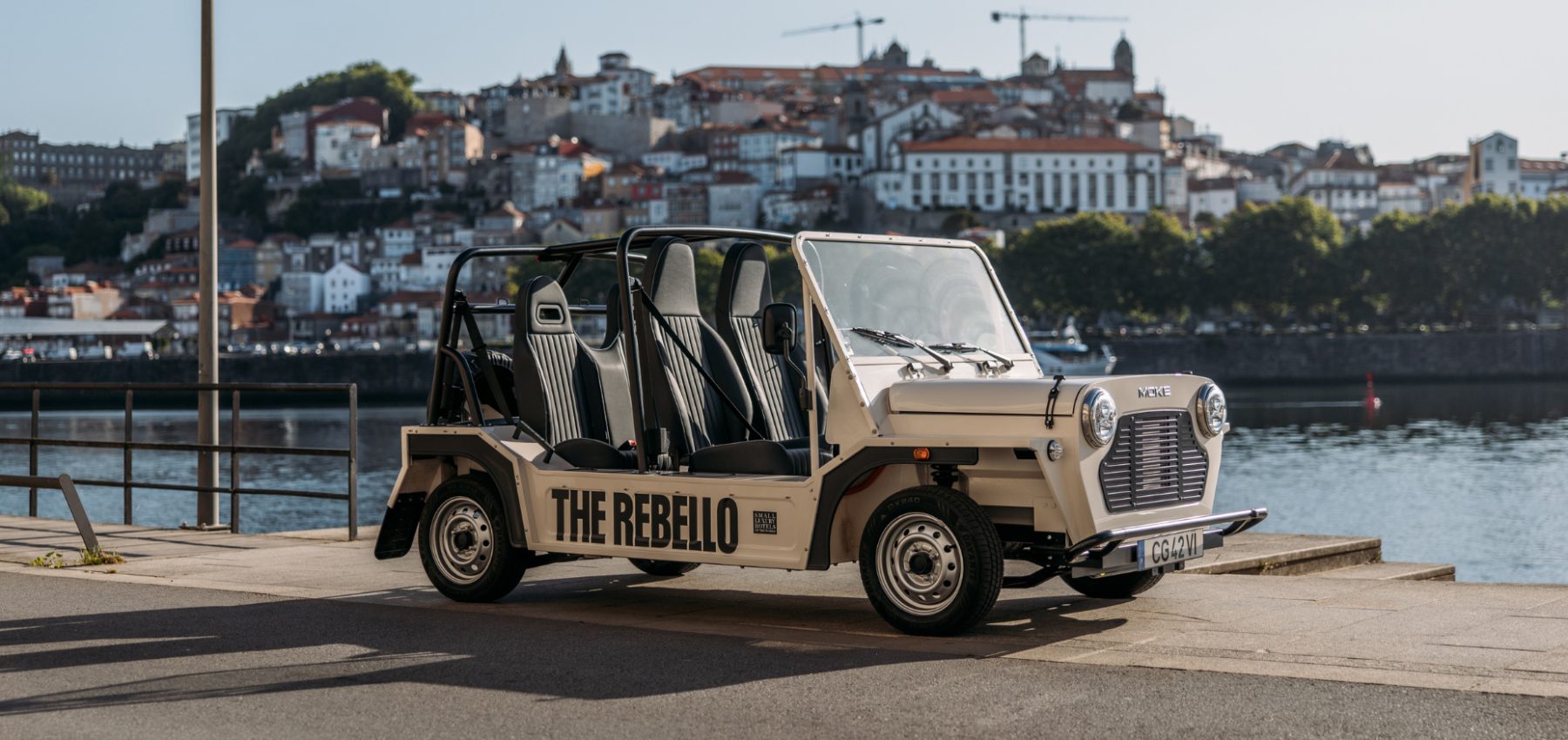 A cream-coloured open-air vehicle labelled 